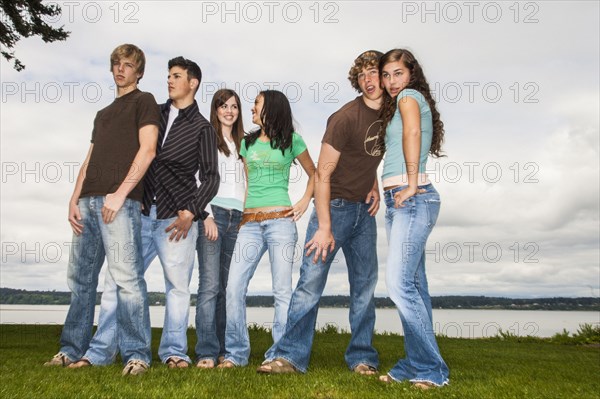 Friends posing near lake