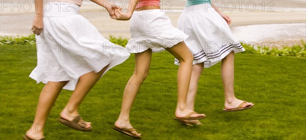 Girls walking and holding hands
