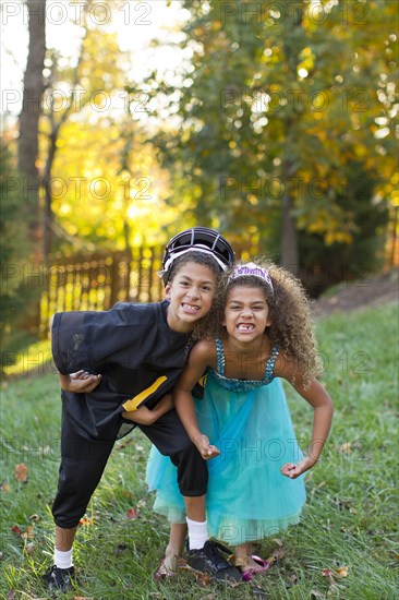 Mixed race children playing together outdoors