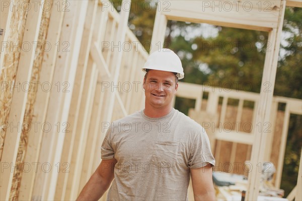 Caucasian construction worker smiling on site