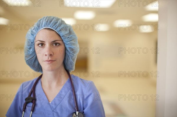 Caucasian nurse wearing hair net in hospital