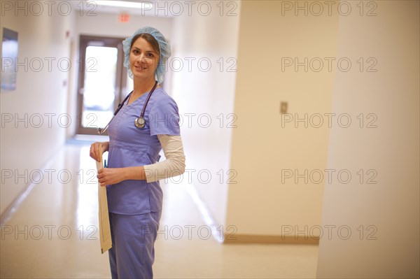 Caucasian nurse wearing hair net in hospital
