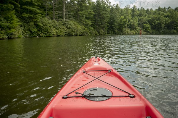 Canoe floating on remote lake