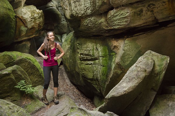 Caucasian woman exploring cave