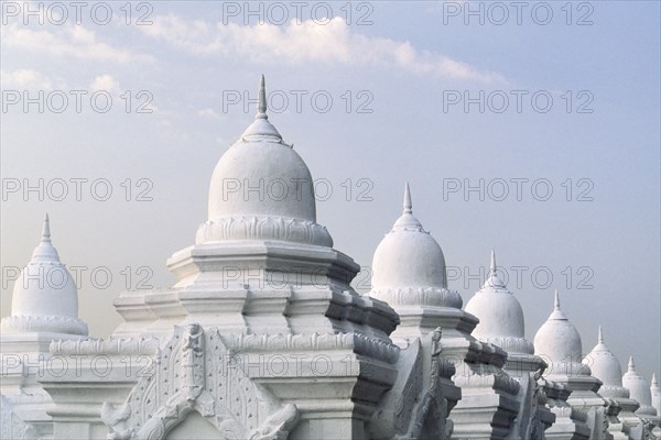 Ornate domes under cloudy sky