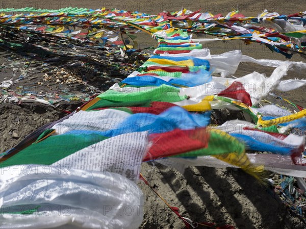 High angle view of prayer flags in wind on remote hillside