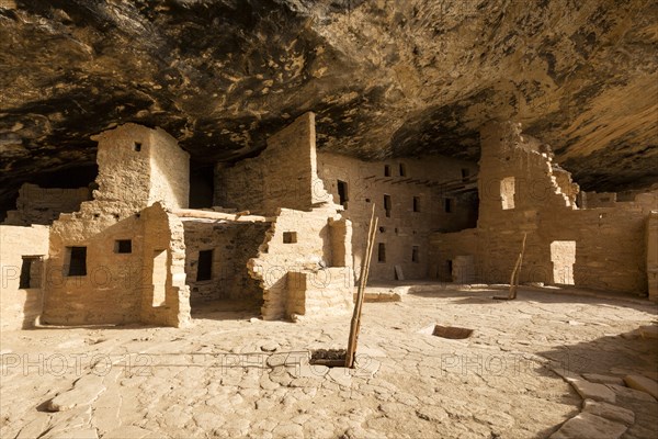 Cliff dwelling ruins in rock face