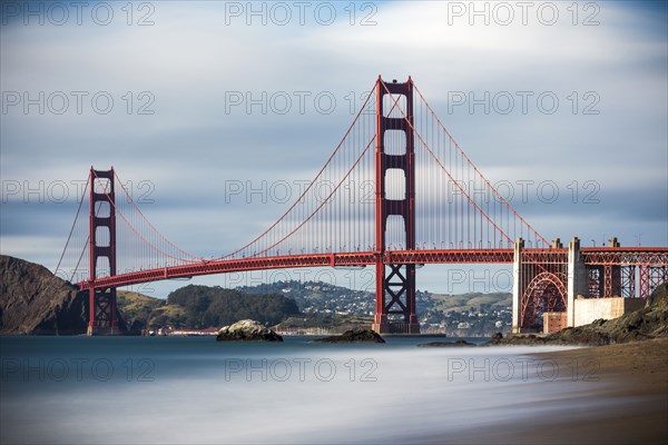 Time lapse view of ocean under Golden Gate Bridge