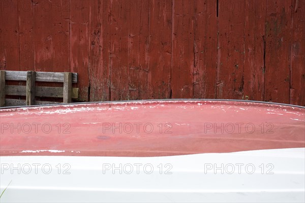 Rowboat stored upside-down at shack