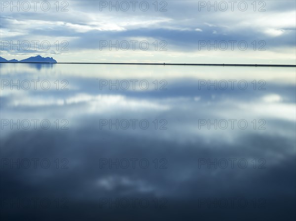 Reflection of clouds in still water