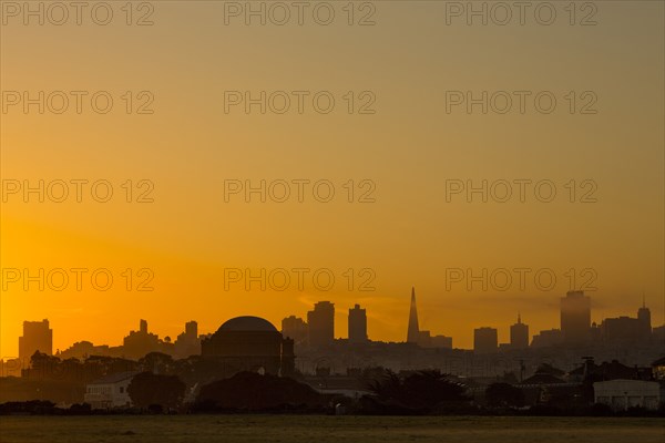 Silhouette of San Francisco city skyline at sunrise