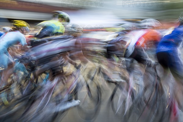 Blurred view of cyclists competing in race