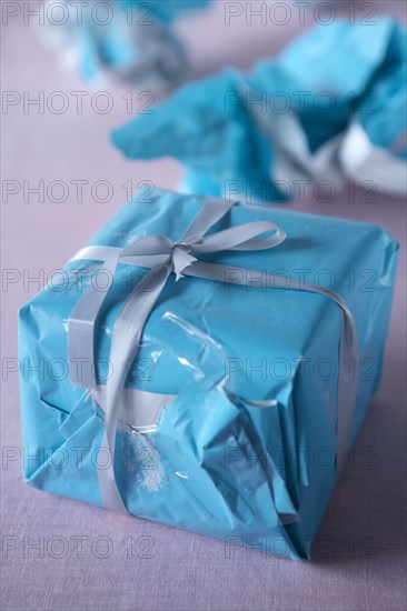 Christmas gift wrapped with wrinkled paper