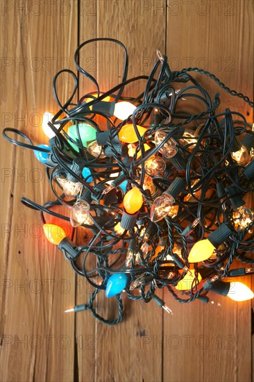 Glowing Christmas lights tangled on floor