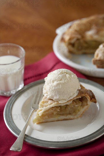 Apple pie al a mode with glass of milk