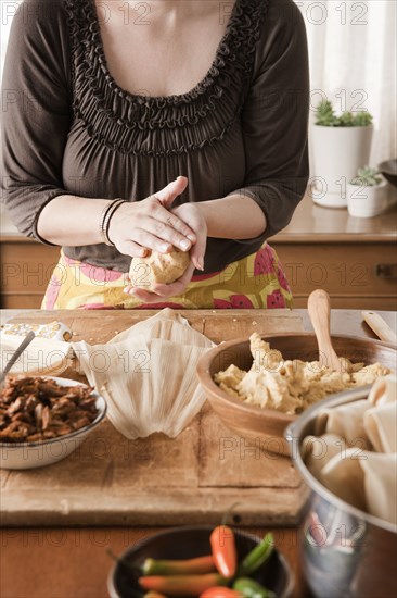 Woman making tamales