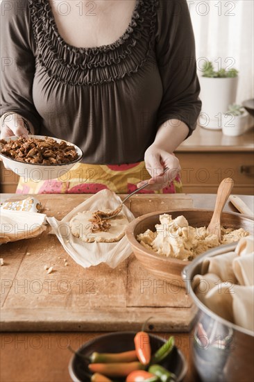 Woman making tamales