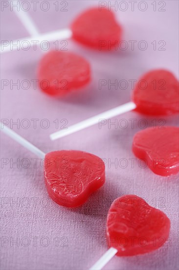 Group of red heart-shape lollipops