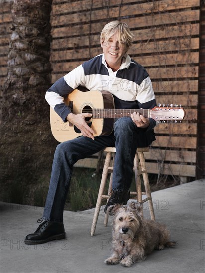 Caucasian man playing guitar