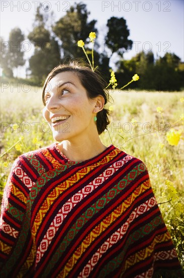 Mixed race woman in field