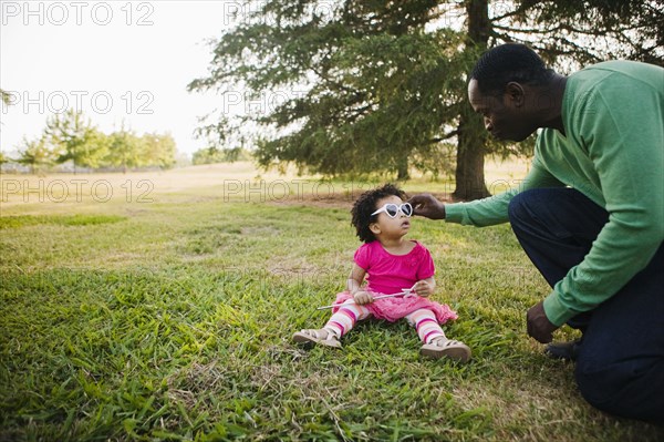 Black father and daughter enjoying the park