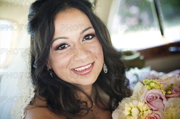 Egyptian bride holding bouquet