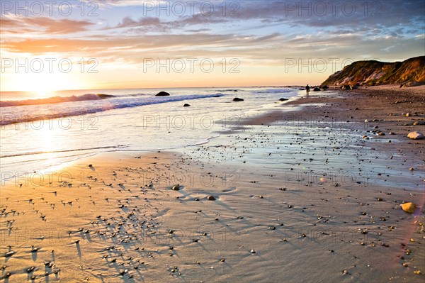 Waves washing up on rocky beach