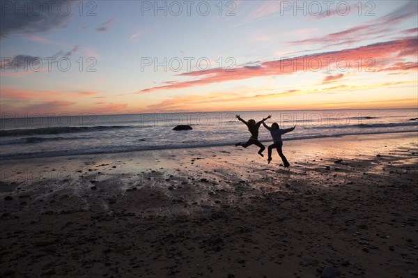 Couple playing on beach