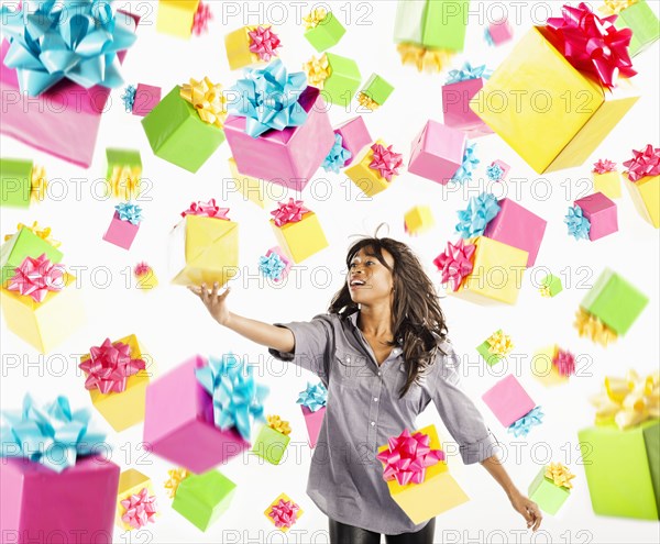 African American woman with falling birthday presents