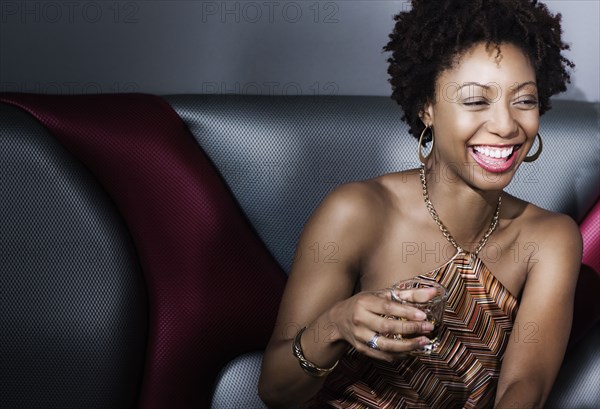 African American woman drinking in nightclub