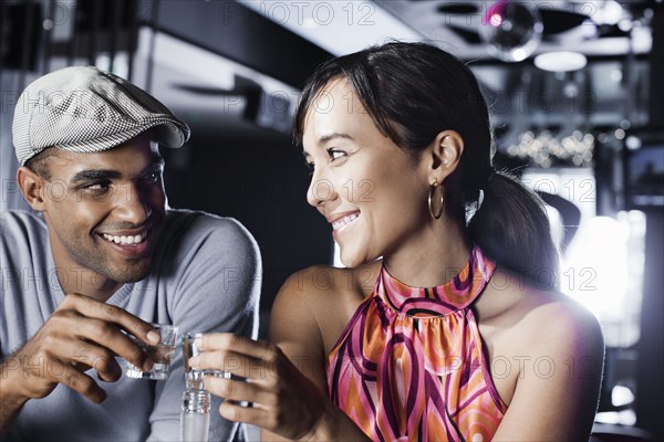 Couple toasting in nightclub