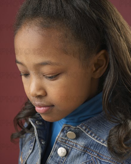 Close up of mixed race girl looking down