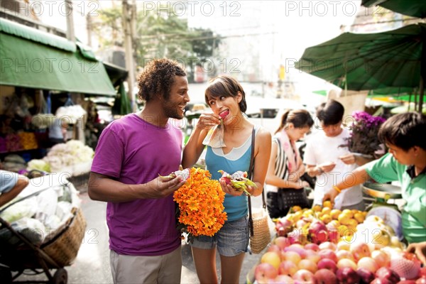 Couple shopping in outdoor market