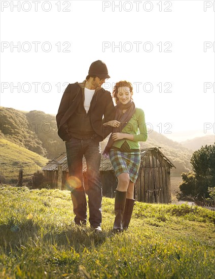 Couple walking in rural landscape