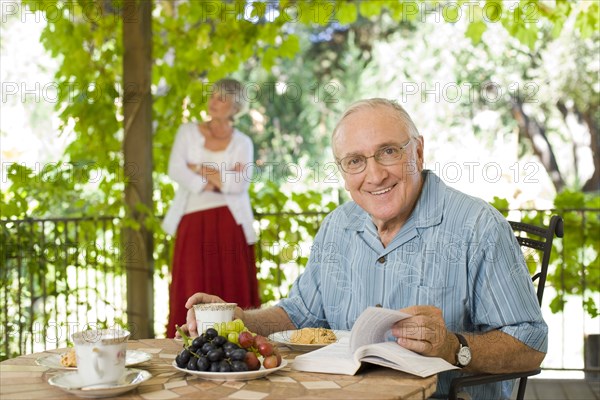 Man having breakfast outdoors