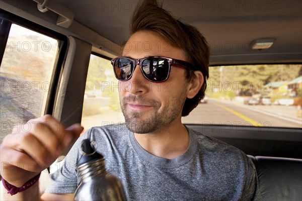 Man sitting in car