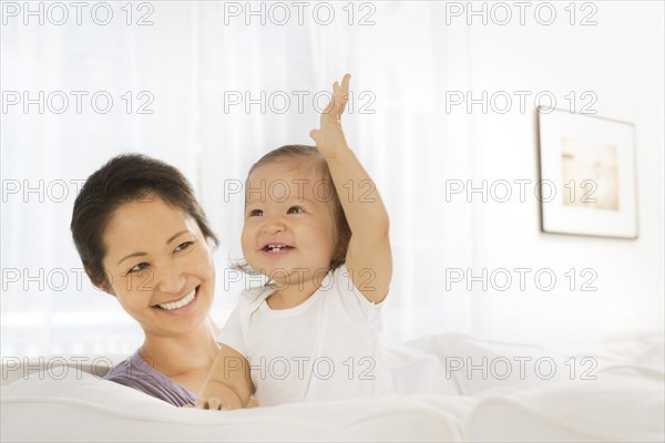 Mother and baby girl in living room