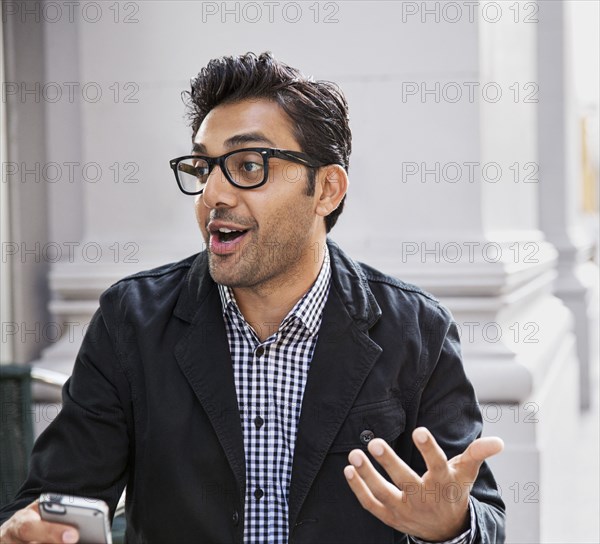 Man talking at sidewalk cafe