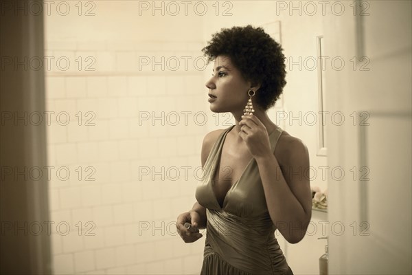 Woman getting ready in bathroom