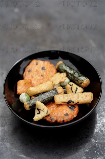 Close up of Japanese rice crackers in bowl