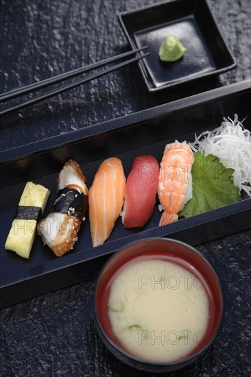 Nigiri sushi with wasabi and miso soup