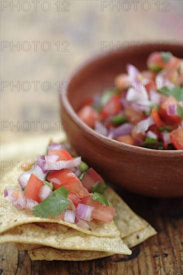 Salsa fresca in bowl and on tortilla chip