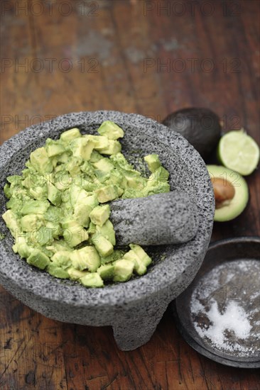 Guacamole in mortar with pestle