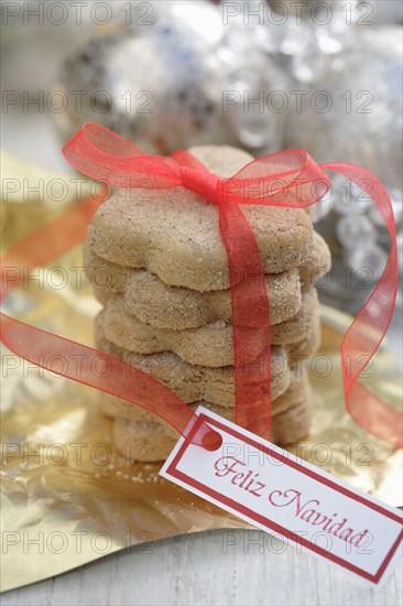 Christmas cookies tied with red ribbon