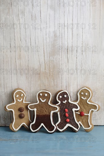 Four gingerbread man cookies in a row