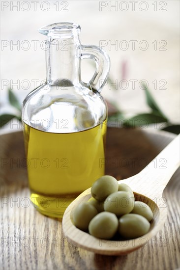 Olives and olive oil in jug