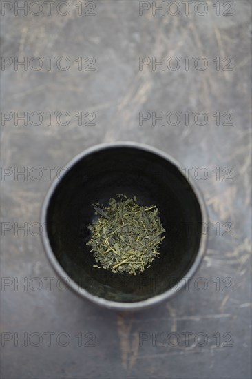 Dried sencha tea in tea cup