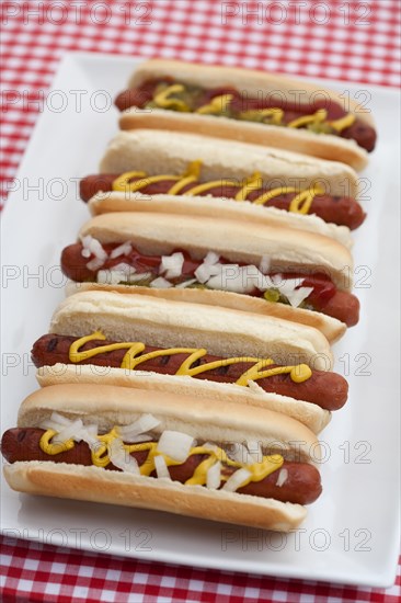 Close up of plate of hot dogs