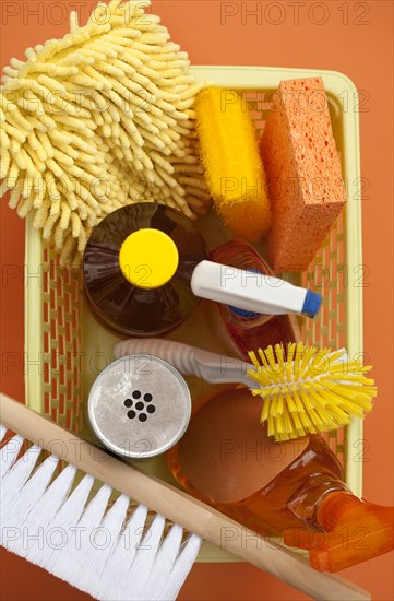 Close up of basket of cleaning supplies