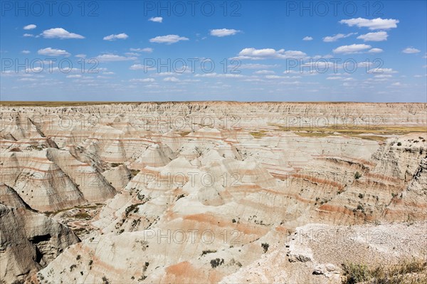 Layered rock formations under blue sky